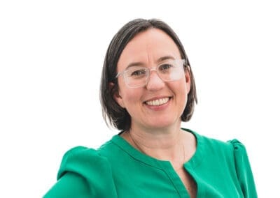 Sarah Dodd of Treelaw in a green dress posing for the camera